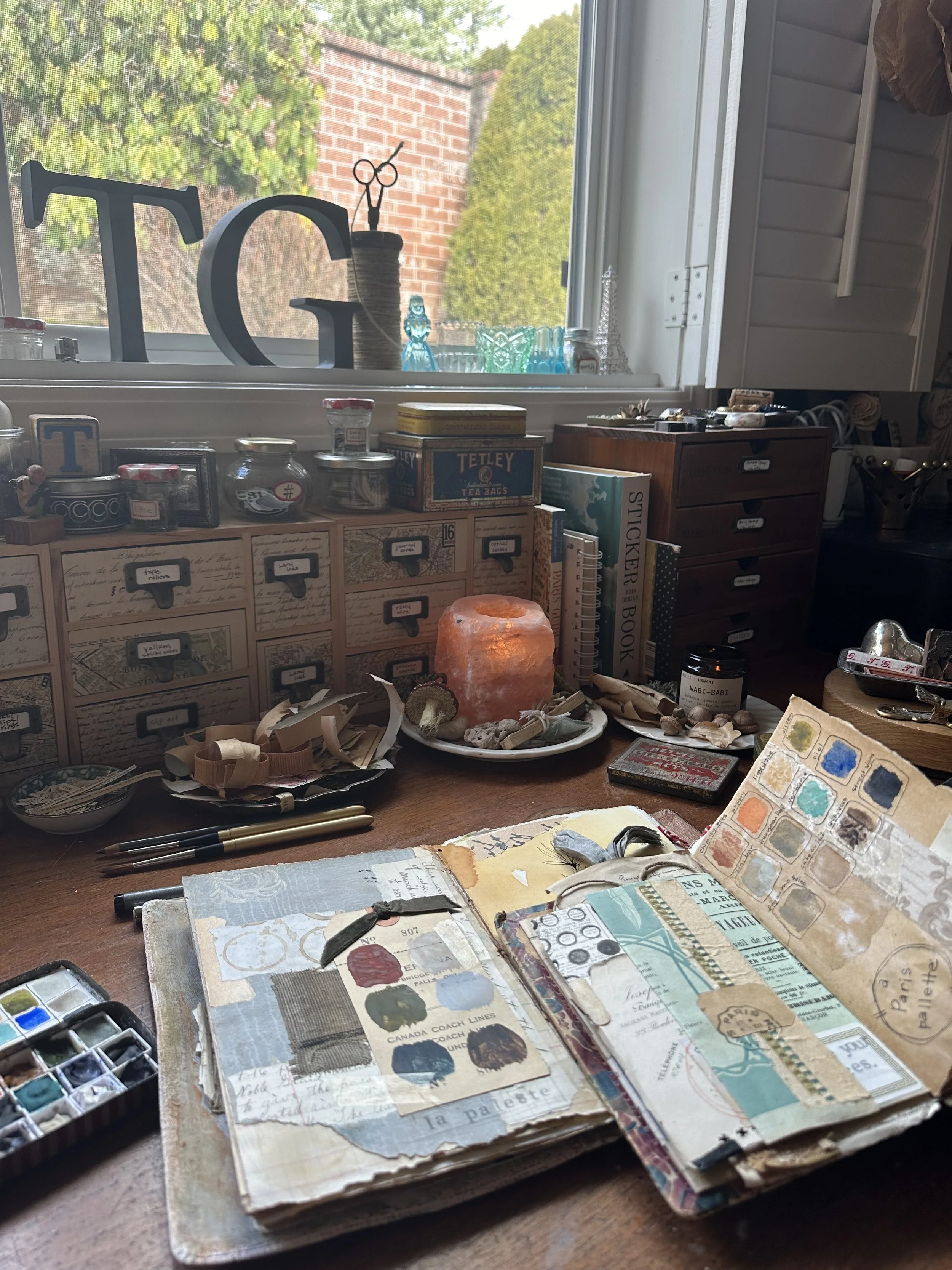 Artist Tammy Gilley’s creative studio filled with vintage ephemera, journals, and art supplies.