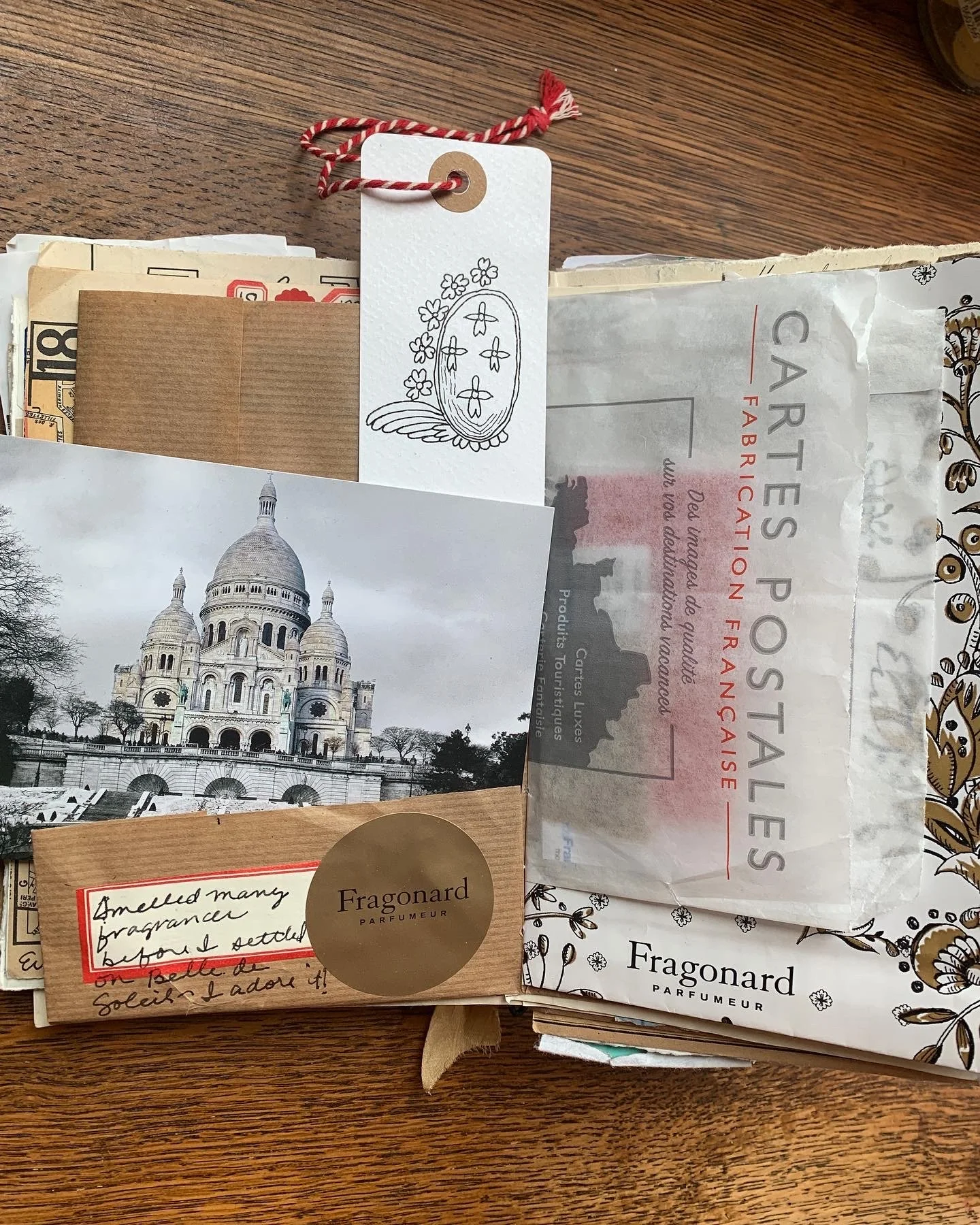 Art journal travel page featuring vintage tickets, map fragments, and collage elements from a trip to Paris.