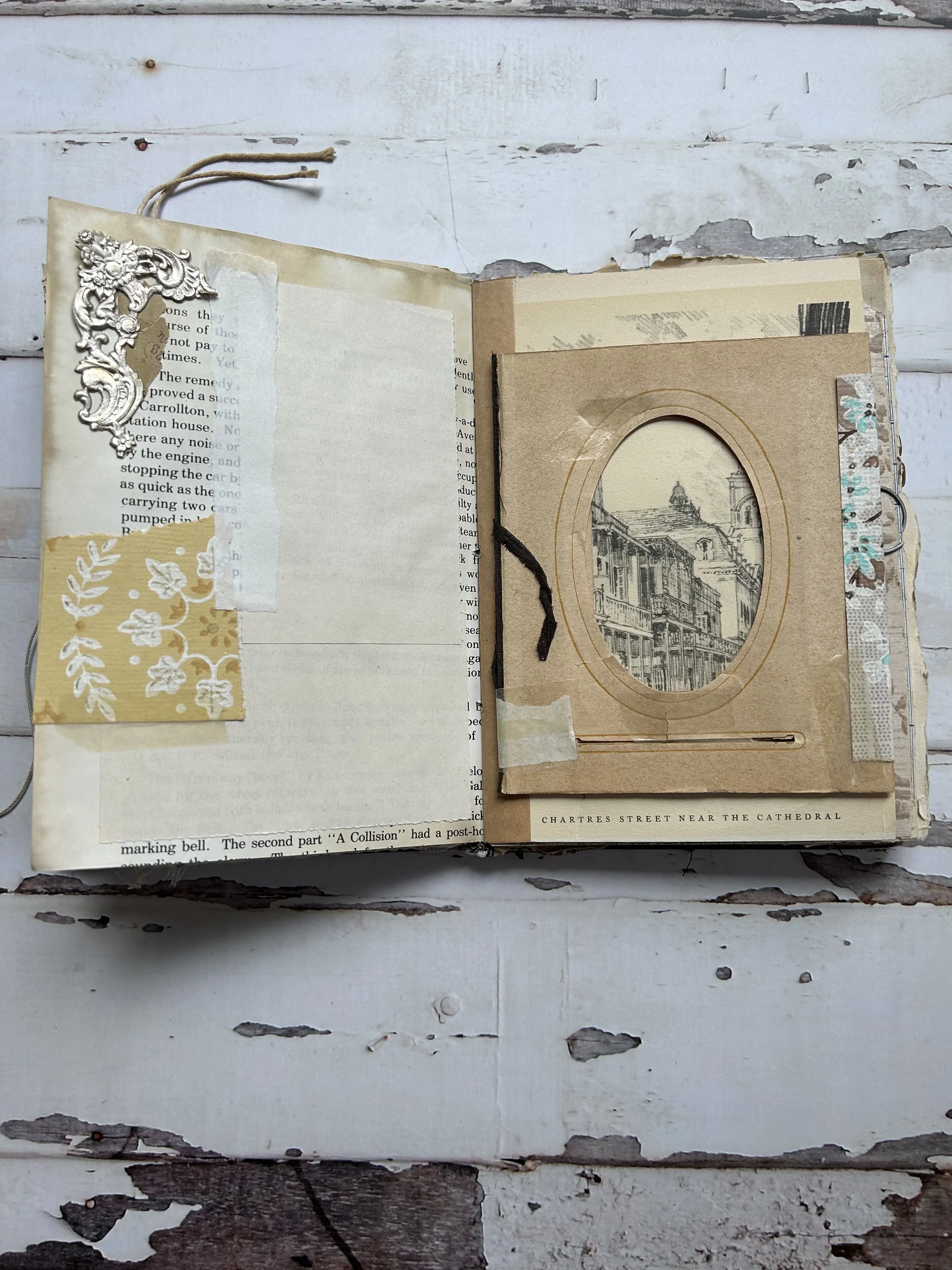 Handmade travel journal page with sketches, handwritten notes, and layered papers documenting a travel memory.