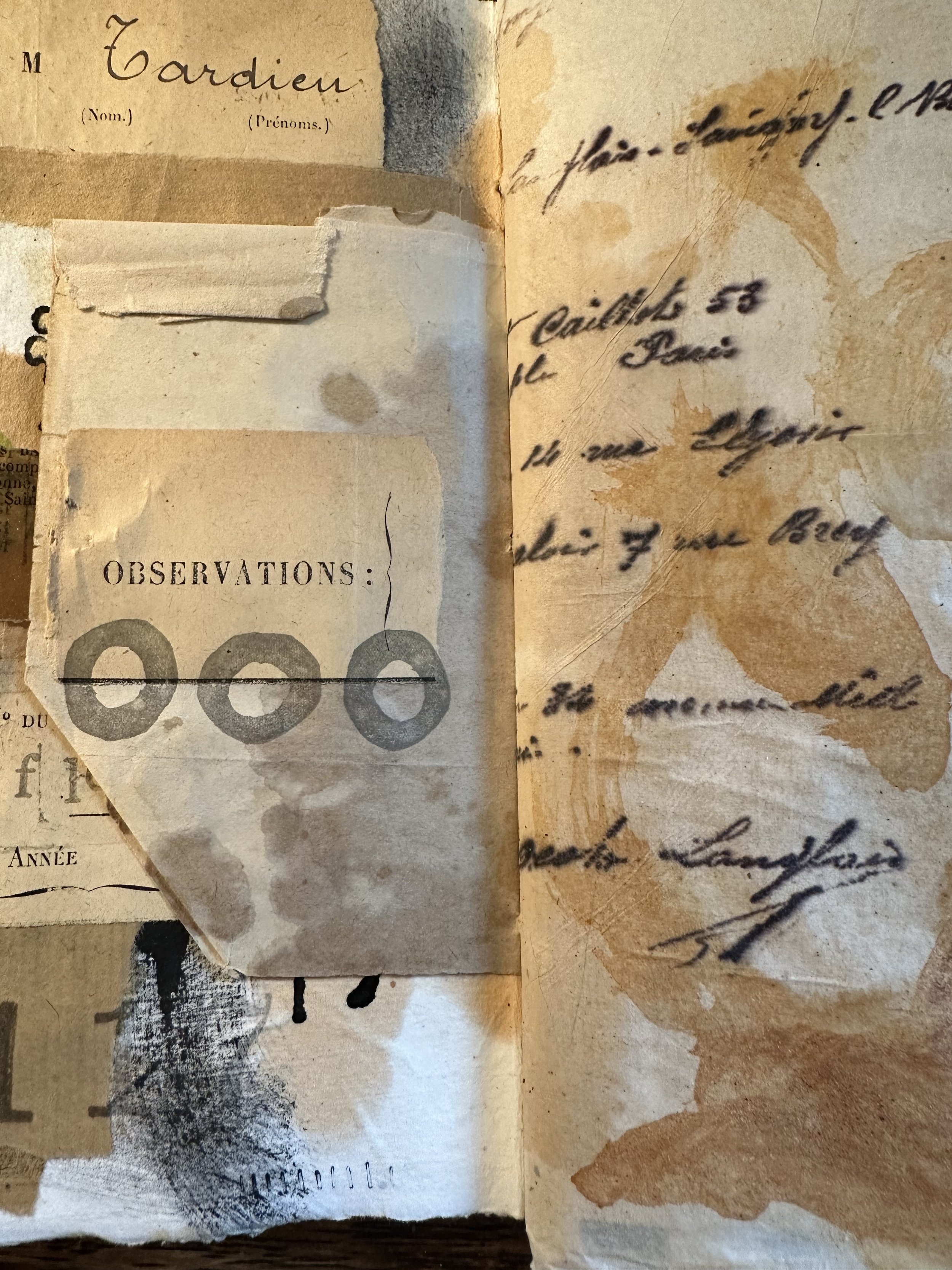 Close-up detail of a handmade art journal collage page with layered papers and textured ephemera.