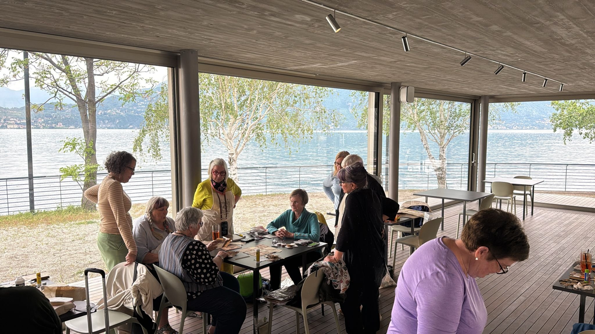 Women participating in a travel journaling workshop on Lake Como, Italy.