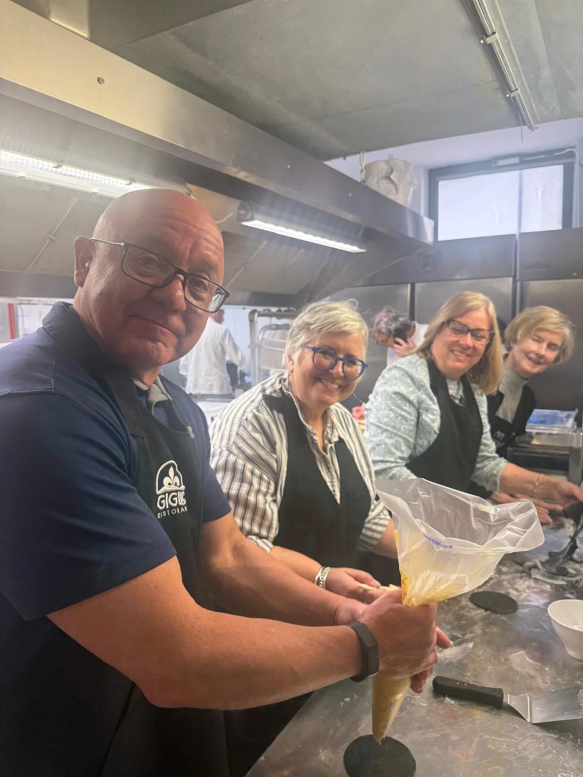 Hands-on Italian cooking class featuring homemade ravioli and tiramisu.