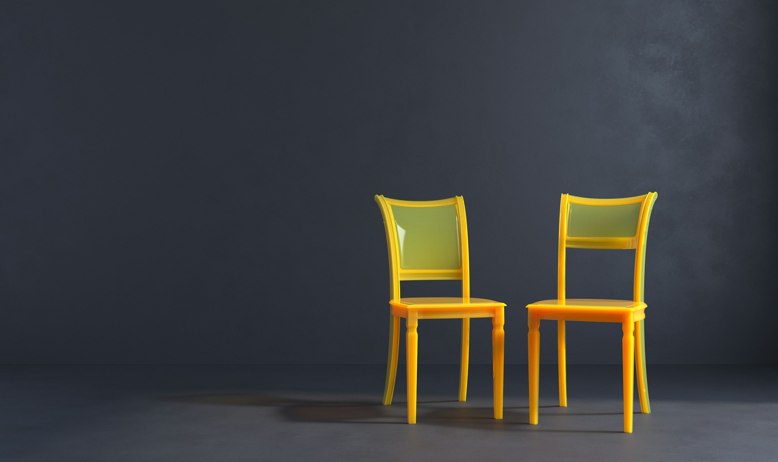 two yellow chairs facing each other