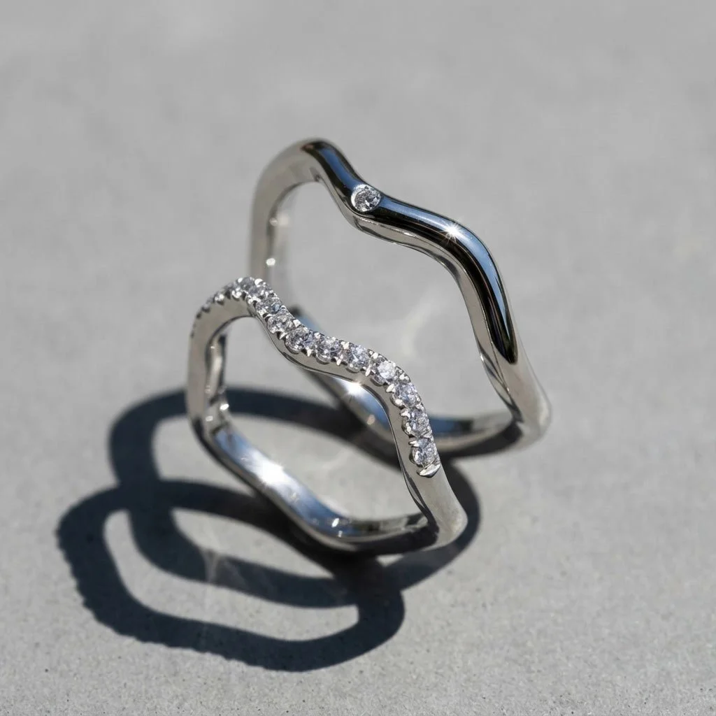 Close-up of Sum of Us collection diamonds wedding rings