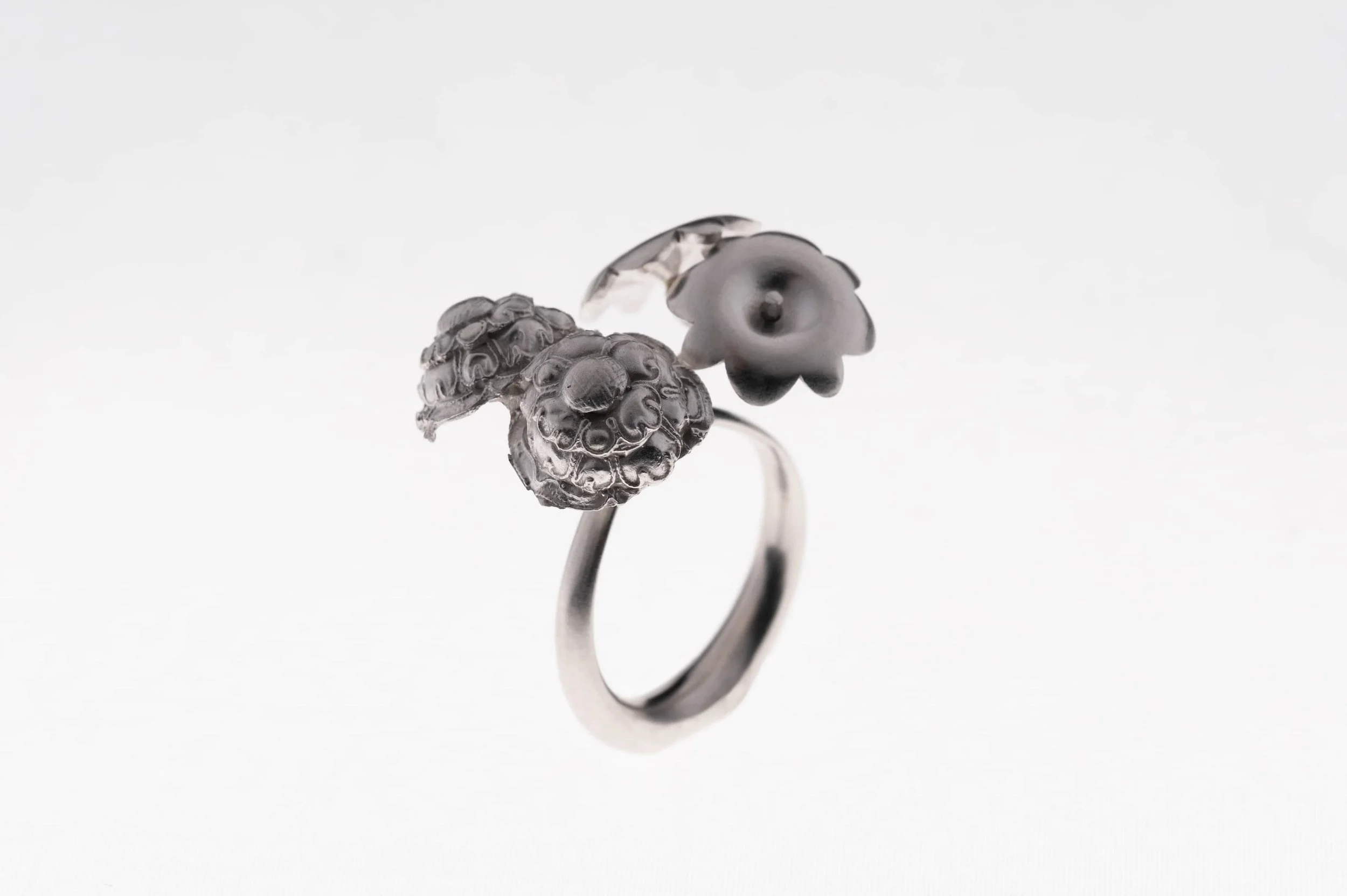 Redesigned artwork from hairpin into flower shape ring on white background