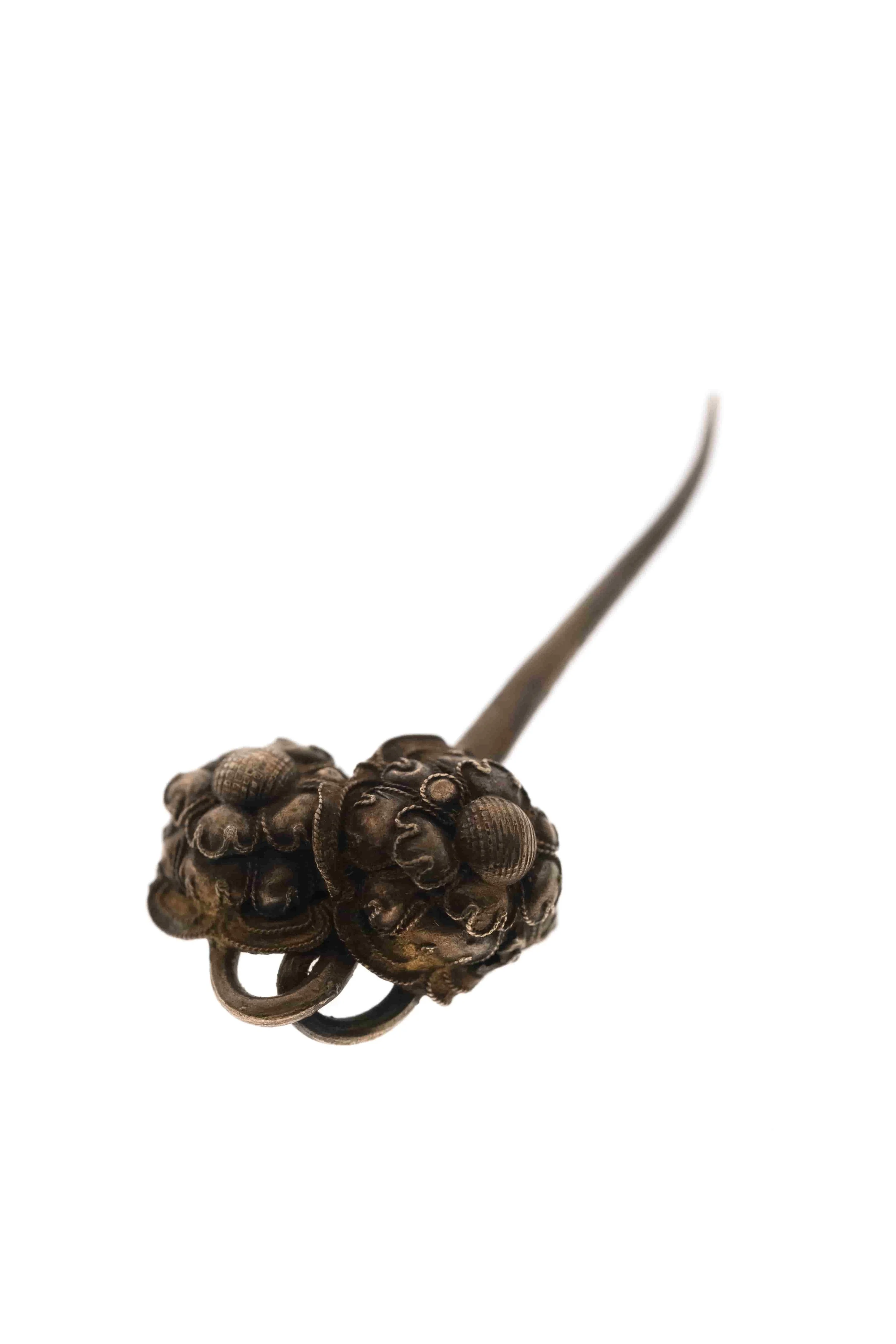 Hairpin with flower shape pattern showed on a white background