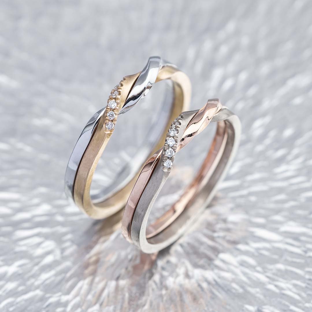 two 18K Gold Material rings on the sliver surface