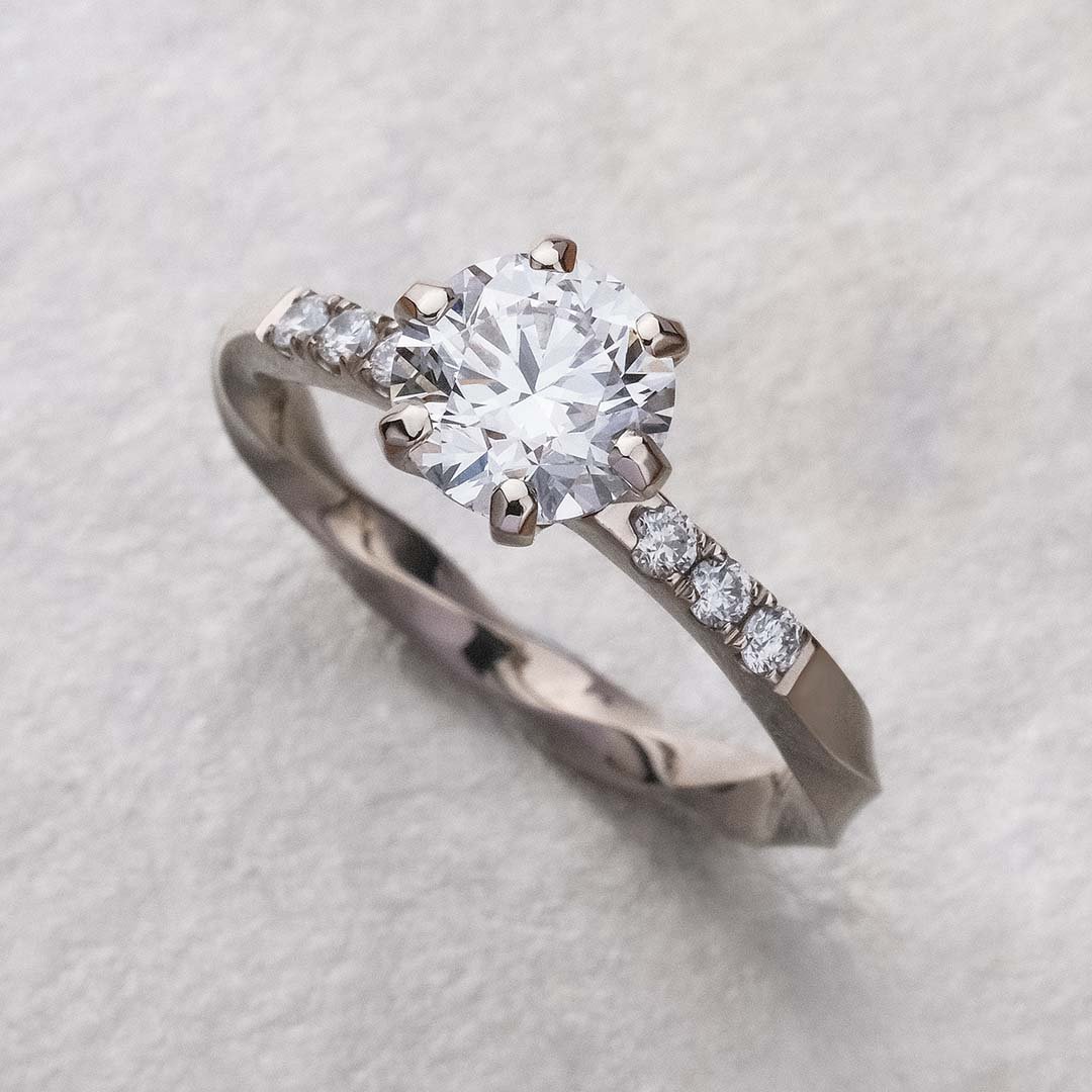 infinity 200% diamond ring place on sliver surface