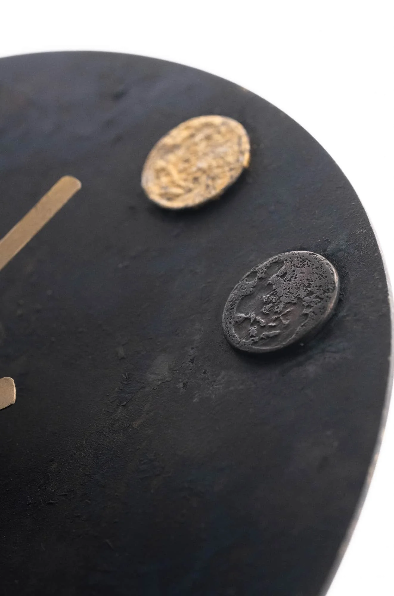 Close up the artwork showing the moon shape graphic on the clock surface