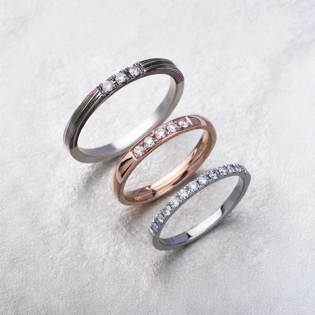 Three rings with stone setting on sliver surface
