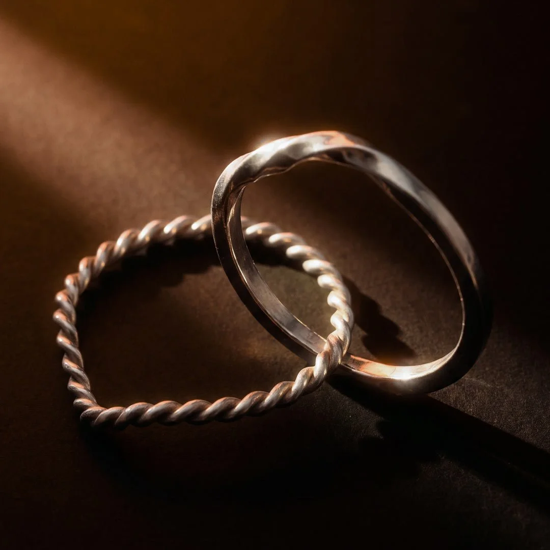 silver Twin Souls Promise ring on a silver surface