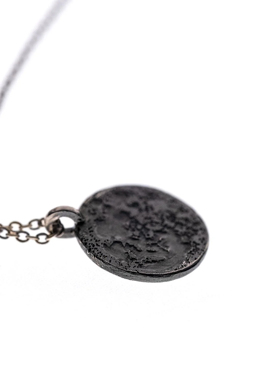 Moon necklace side view on a white clear background