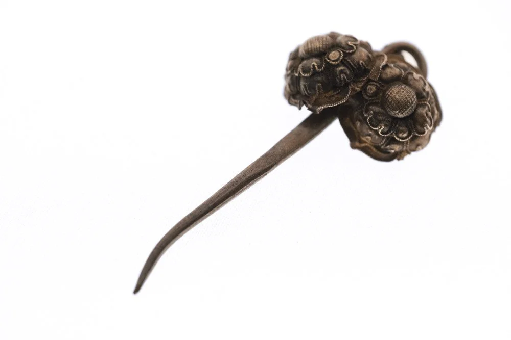 A hair pin made in late qin dynasty on white background