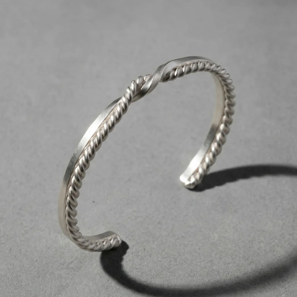 Close-up of silver Twin Souls Promise bracelet on a silver surface