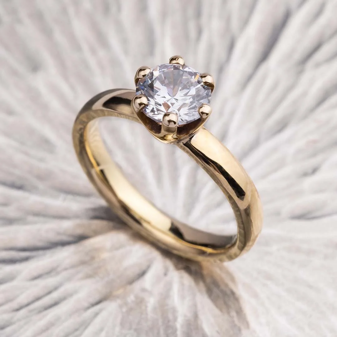 Moonlight 200% diamond ring placed on sliver surface