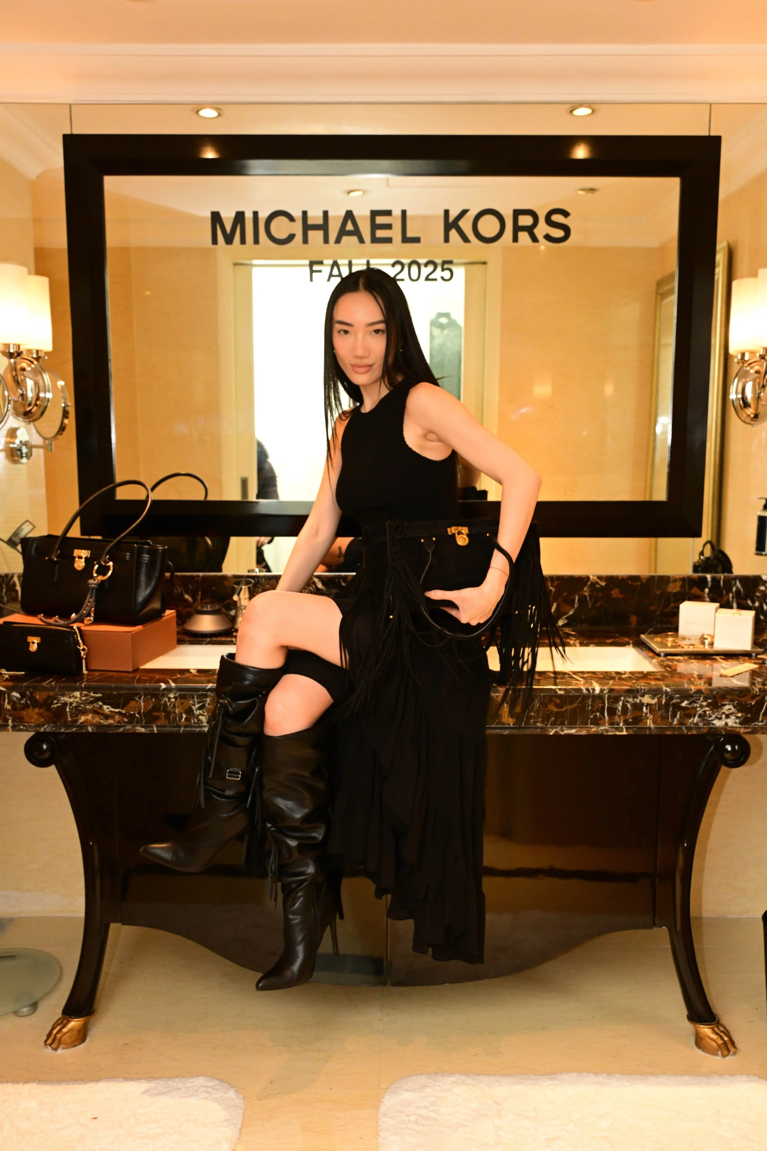 Jessica Yang in Michael Kors ready-to-wear and black Hamilton Fringe Satchel (2).jpg