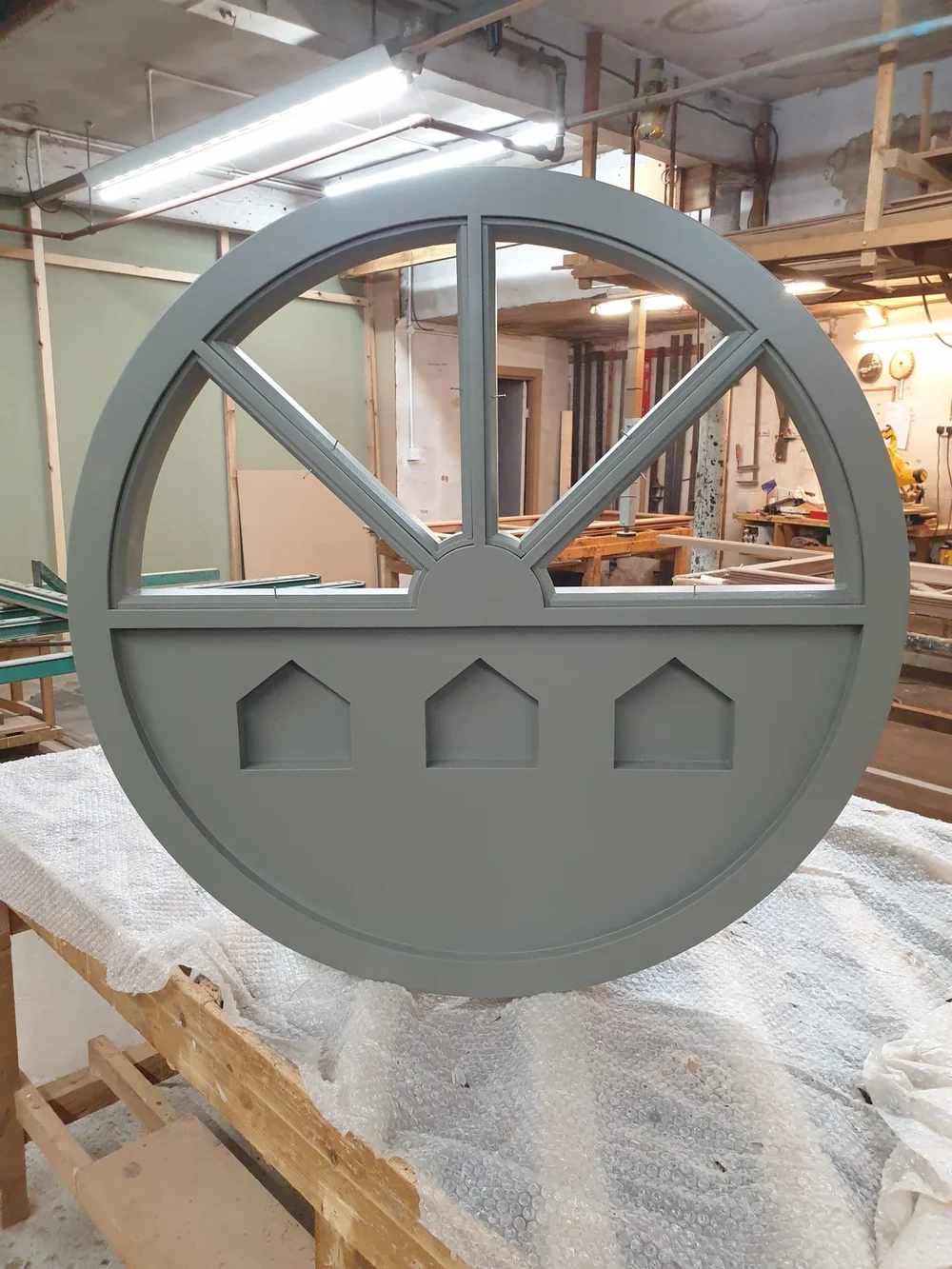Arched and round timber window made to fit the opening