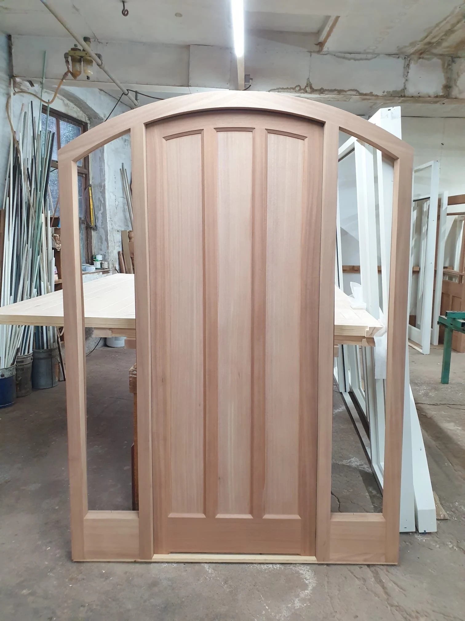 Wooden arched door in workshop