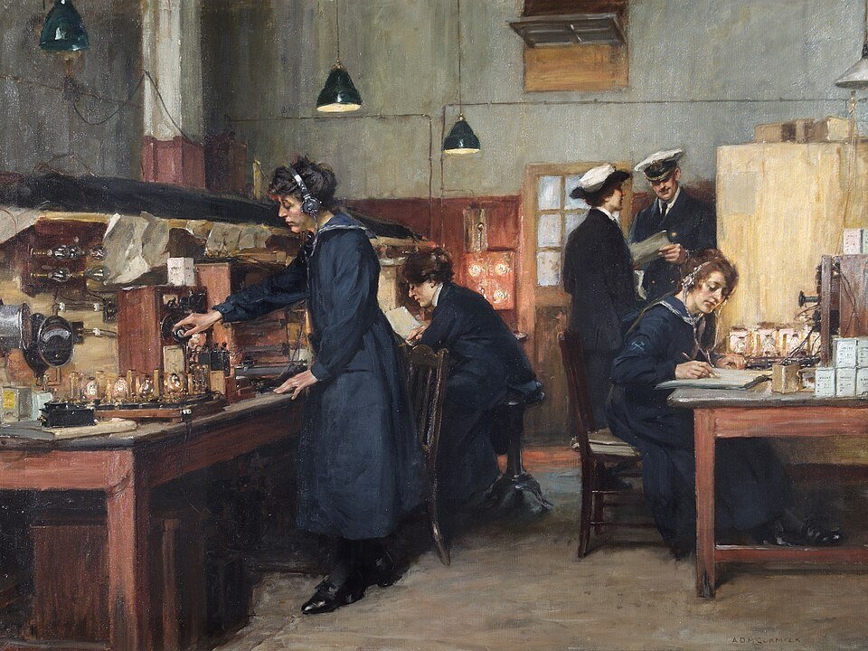 A painting of the Signal School at the Royal Naval Barracks, Portsmouth, showing women in dark uniforms testing wireless valves at a workbench, one wearing headphones, another writing up results at a desk while a naval officer looks on.