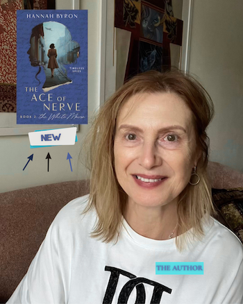 Author Hannah Byron smiling while seated indoors, with the cover of The Ace of Nerve: Book 2 – The White Mouse displayed beside her to announce the novel's release.
