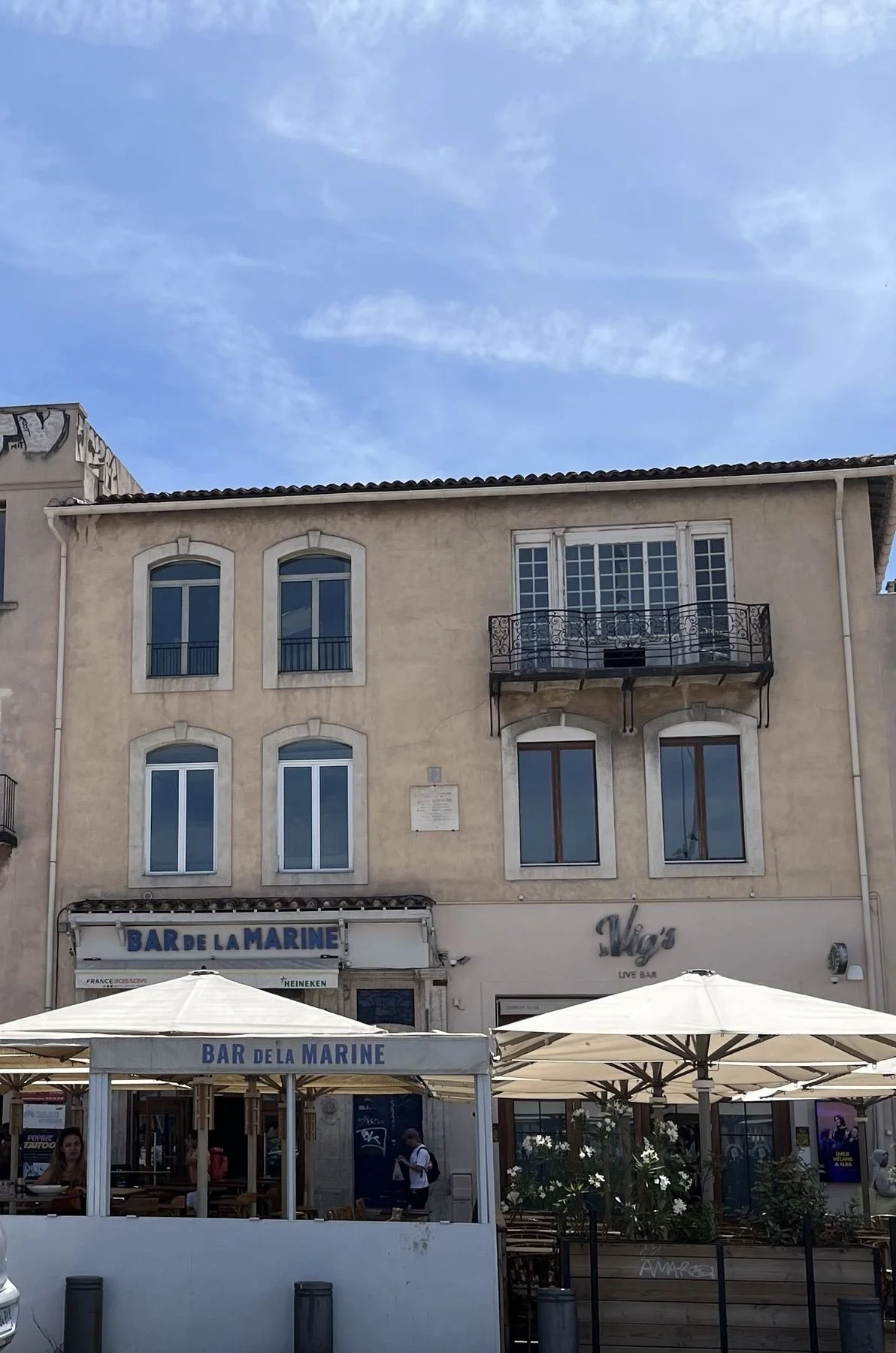 Number 15 Quai de Rive Neuve: a modest building above the Bar de la Marine, lower and plainer than its grander neighbours. Lise de Baissac's flat was upstairs.