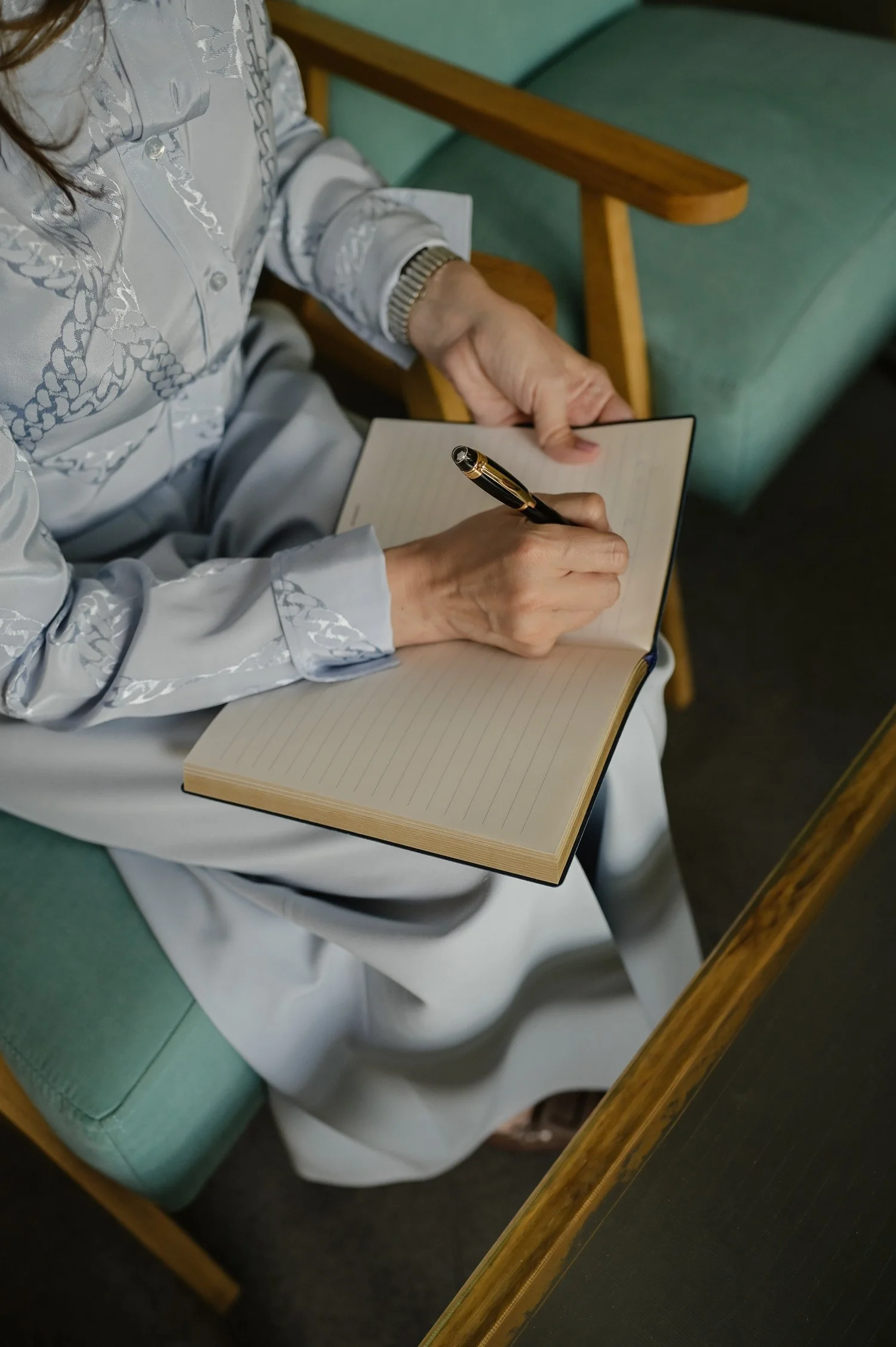 hand and notebook