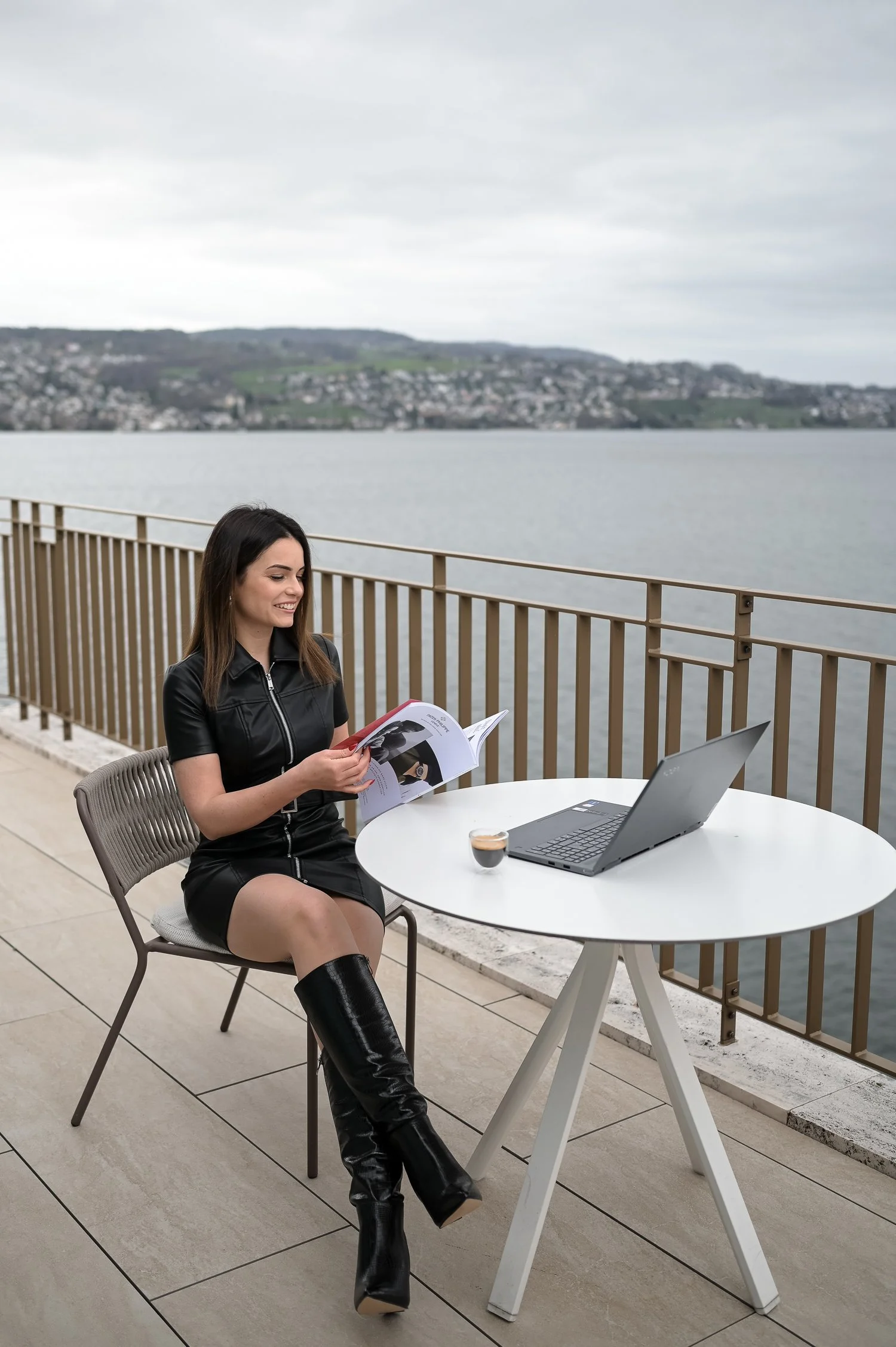 woman-sitting-in-a-hotel-with-lake-view-1500w.jpg