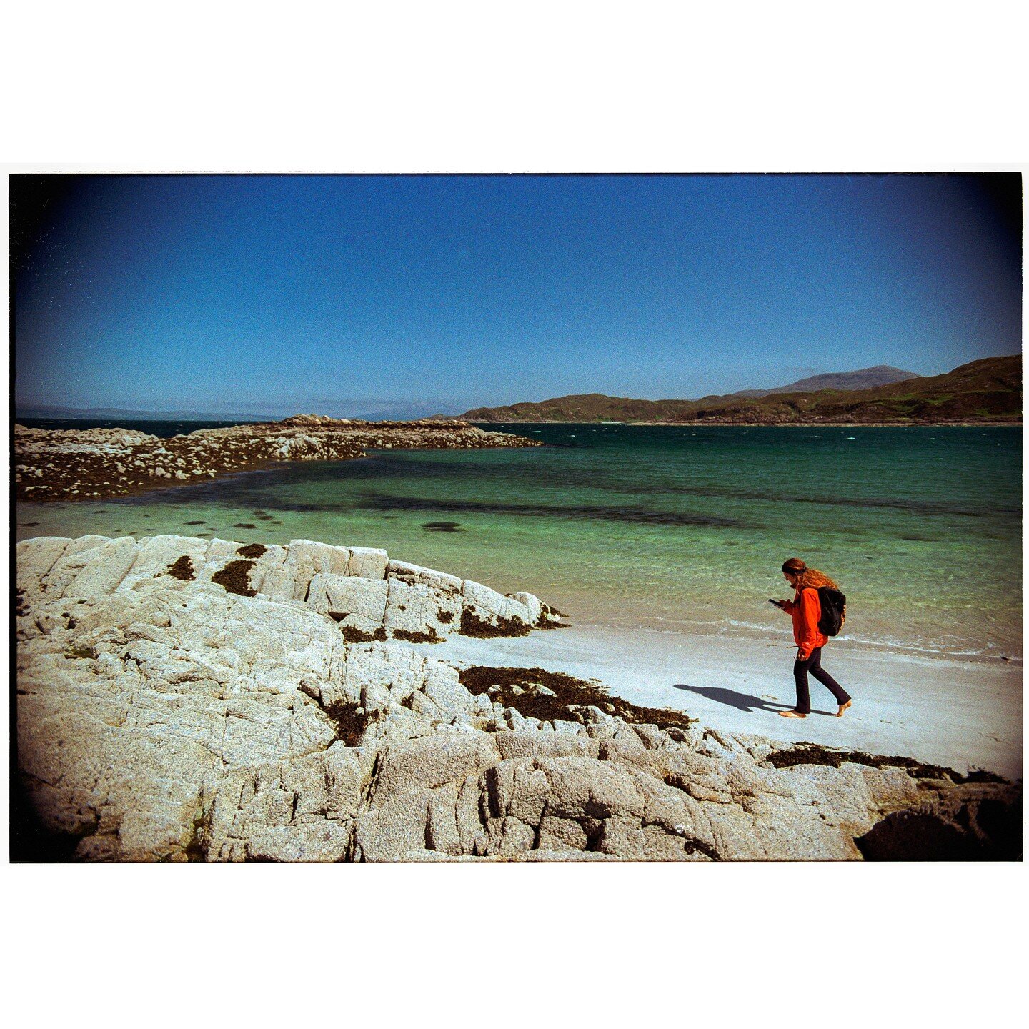 NEVER REALLY HERE #13

Whilst walking on a white sandy beach, a woman looks down to her phone, perhaps to the photos she has just taken, perhaps posting them on social media.

Digitized colour film negative - 2023

#scotland #scotlandphotography #sco