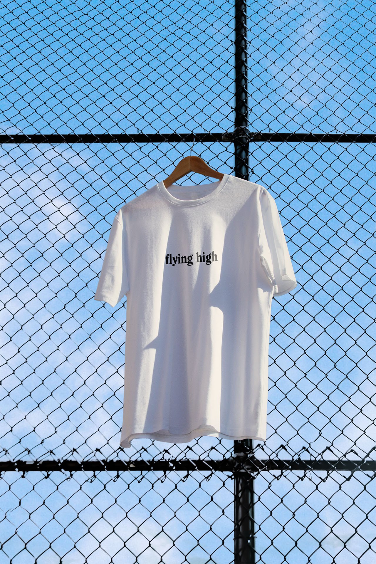 Merch design on the front of a t-shirt meant for athletes going to CrossFir competition with the box's motto.jpg