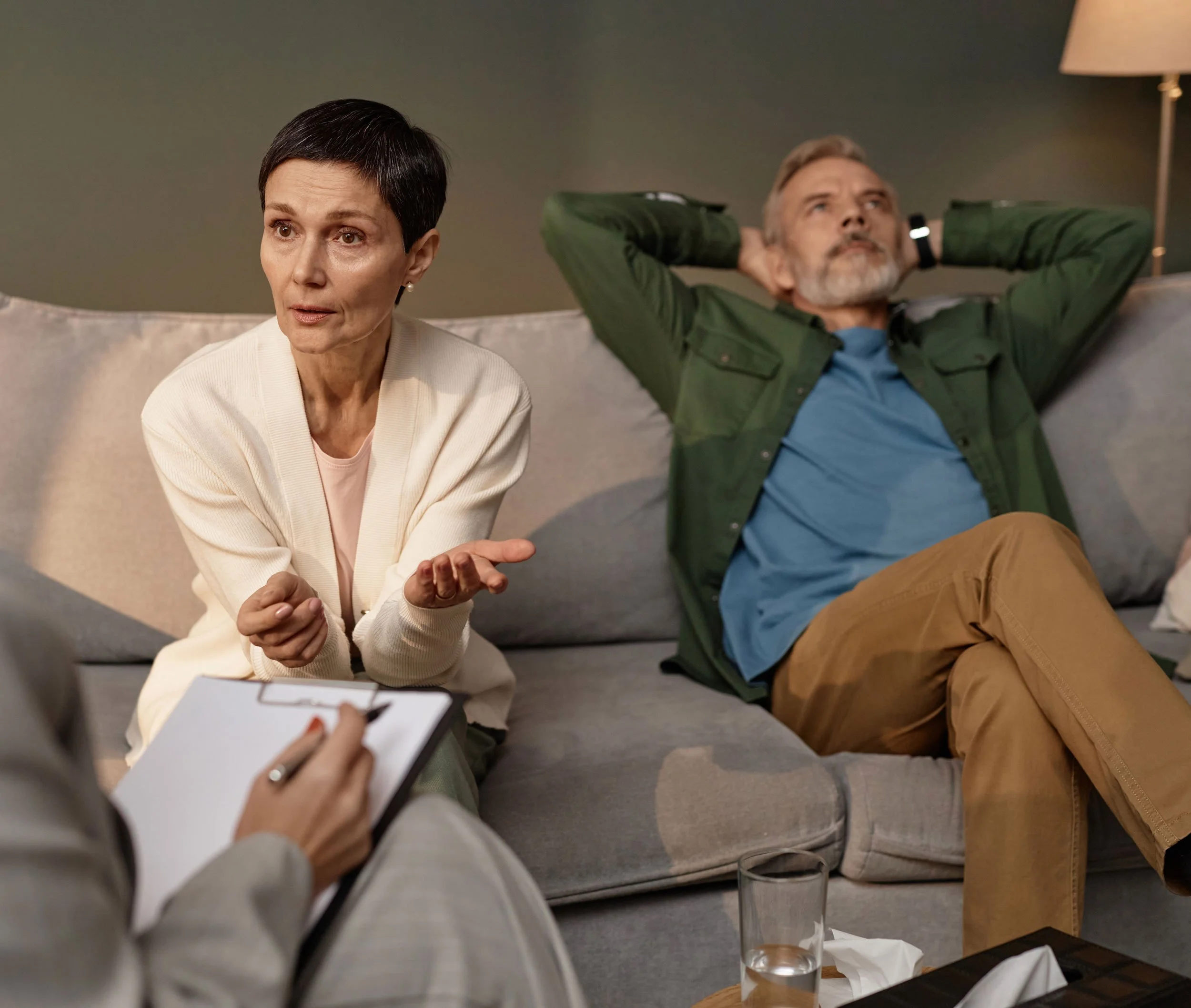 Couple in a mediation session with a Maryland family law mediator, representing divorce after illness, financial crisis, or loss