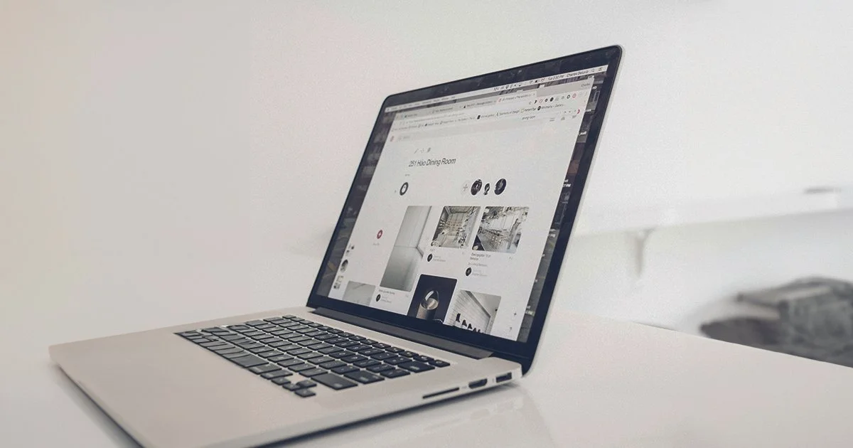 A laptop computer open on a website designed by Sodium & Co. as part of their charity branding services.