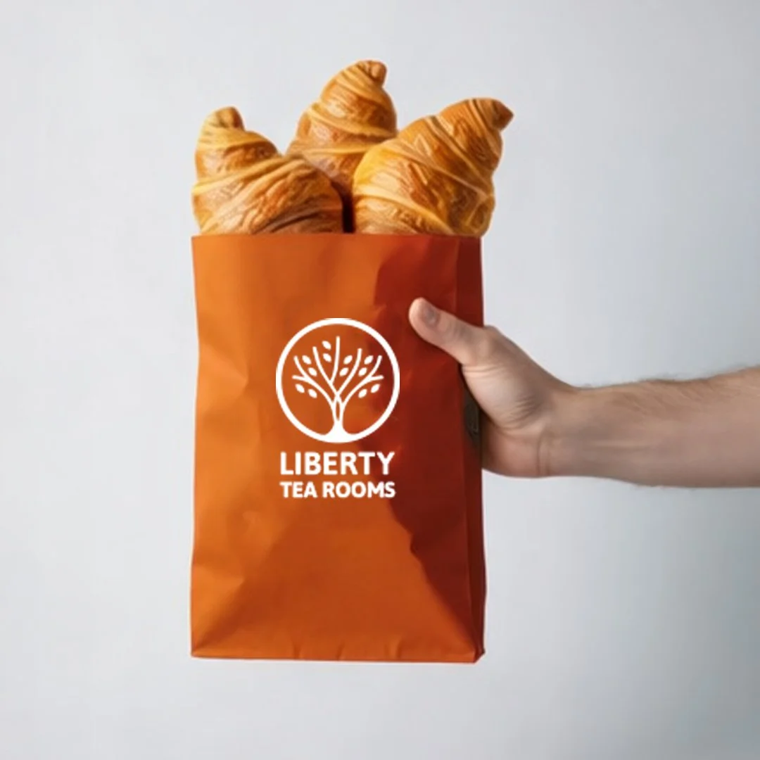Liberty Tea Rooms branded takeaway packaging designed as part of the Liberty Hub brand identity.