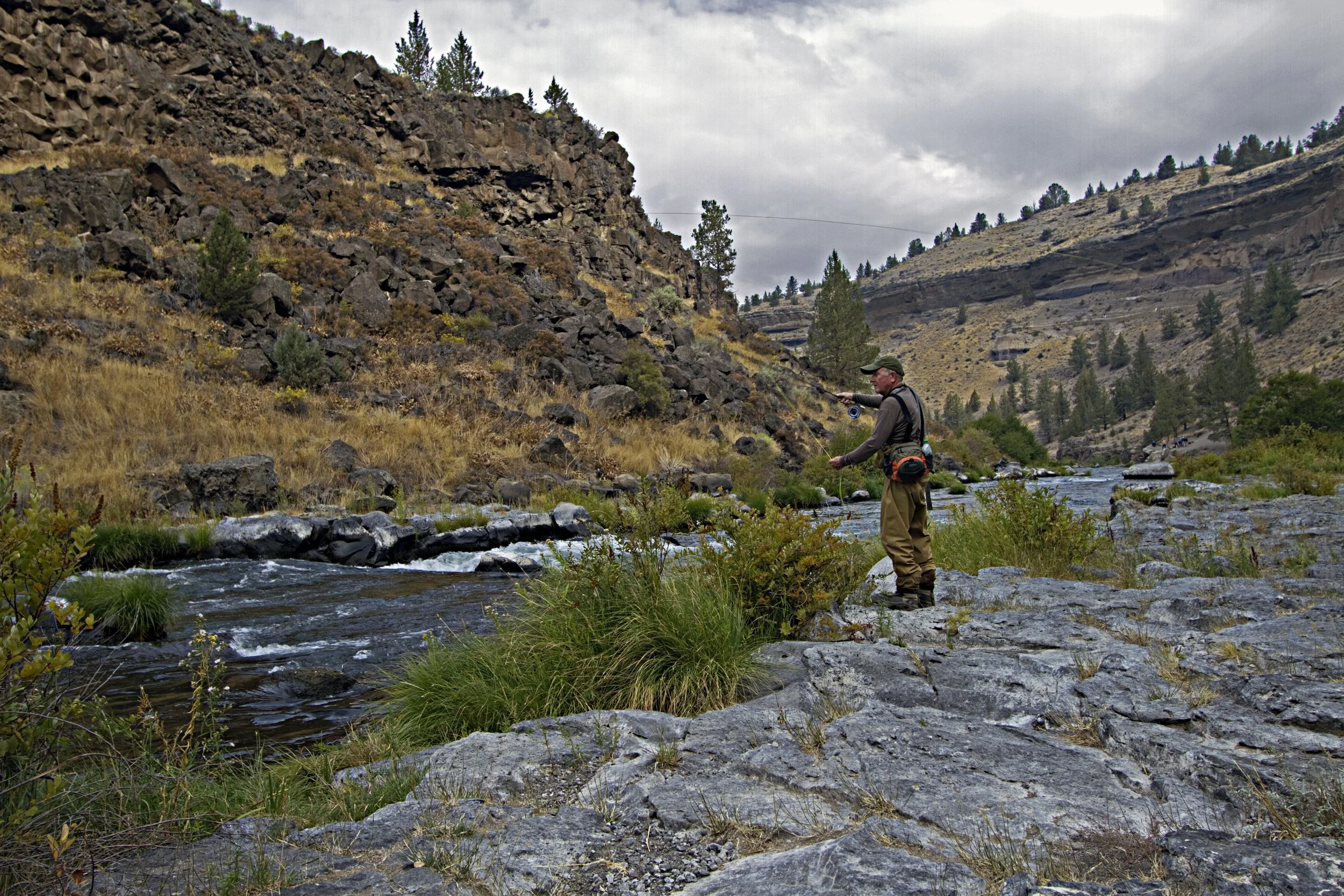 Person fishing on a river