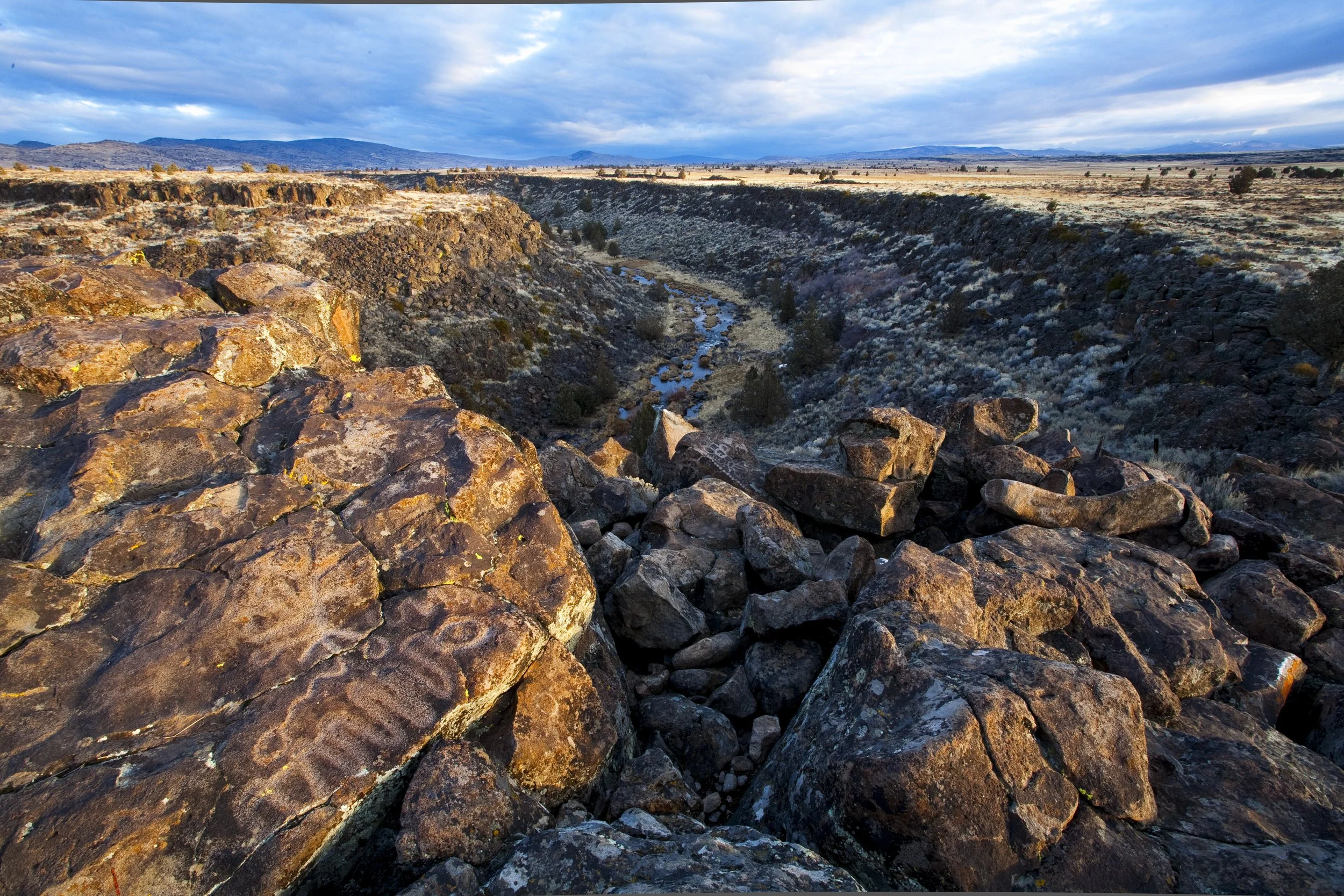 Petroglyphs with river in background