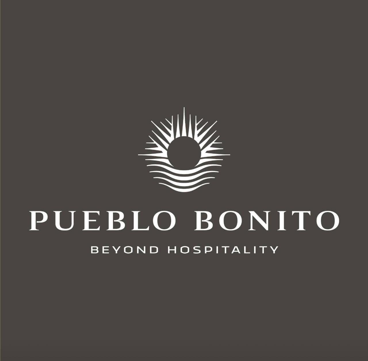Pueblo Bonito logo with sun design and 'Beyond Hospitality' slogan.