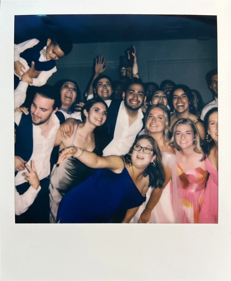 Polaroid of a wedding party celebrating