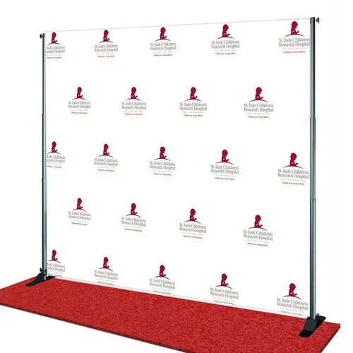 Step and repeat backdrop with the logo of Saint Jude Children's Research Hospital, set up on a red carpet with vertical poles and floor weights.