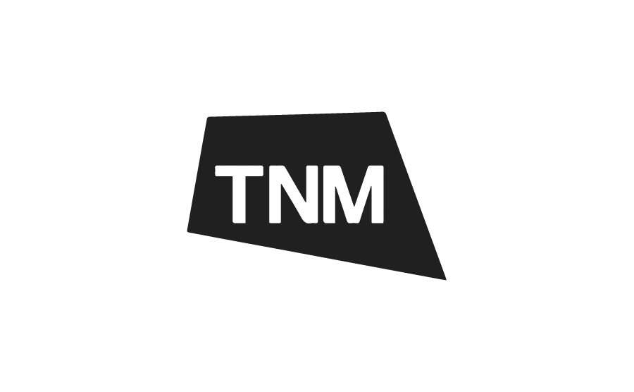 Black polygon with white text reading "TNM" inside.