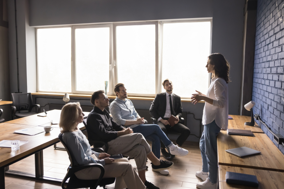 Small business meeting with woman presenter