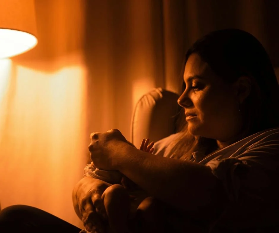 Mum comforting baby at night - responding to frequent baby night waking
