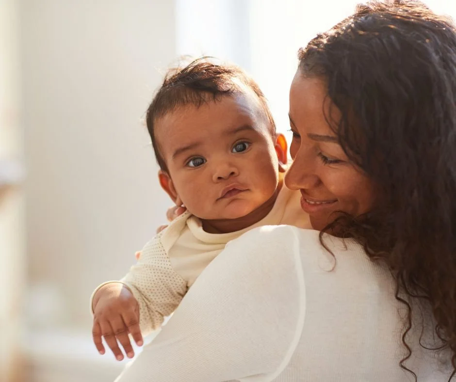 Mum comforting her highly sensitive baby who is wide awake and alert