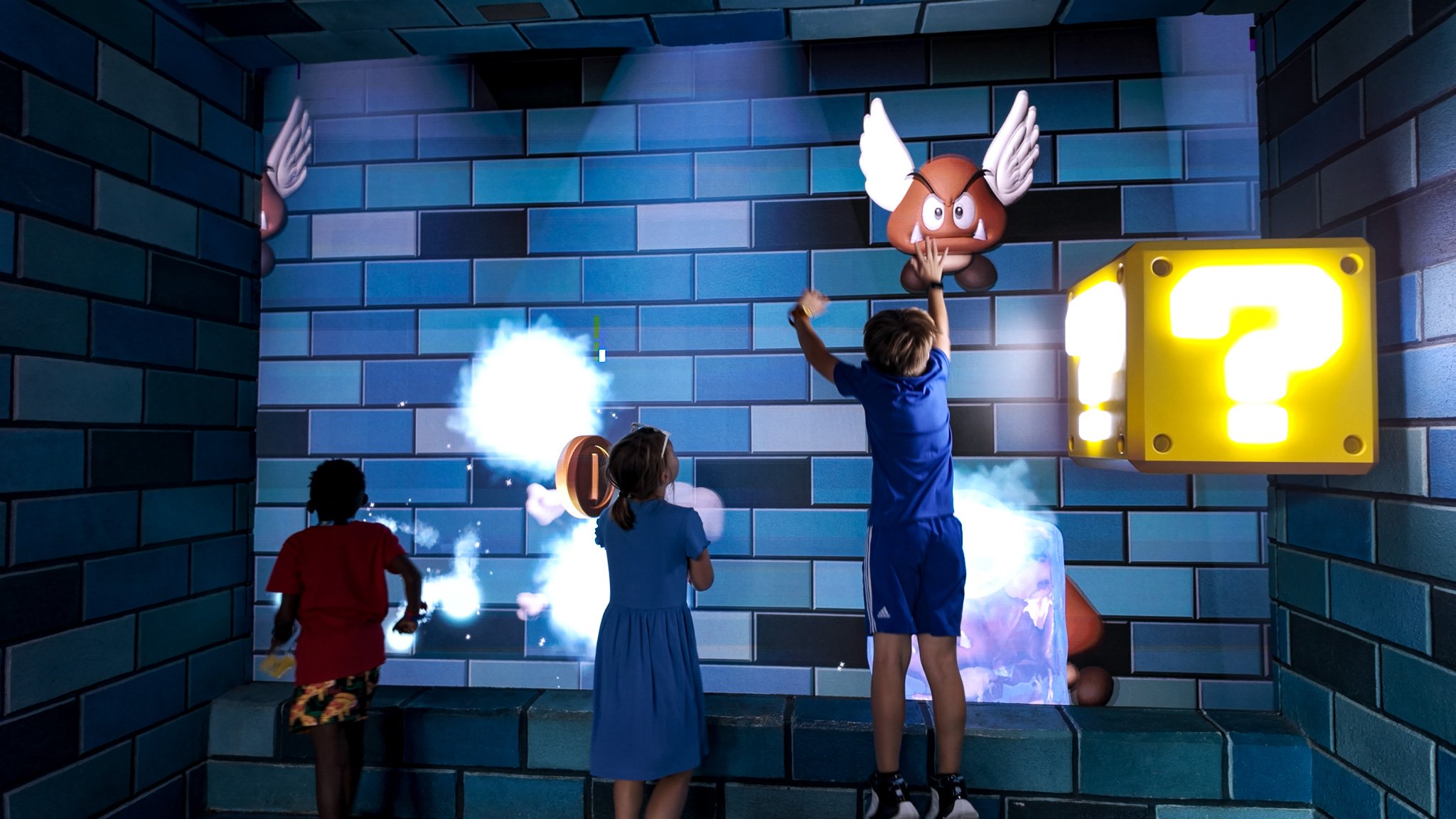 Tweens playing games at Super Nintendo World.jpg