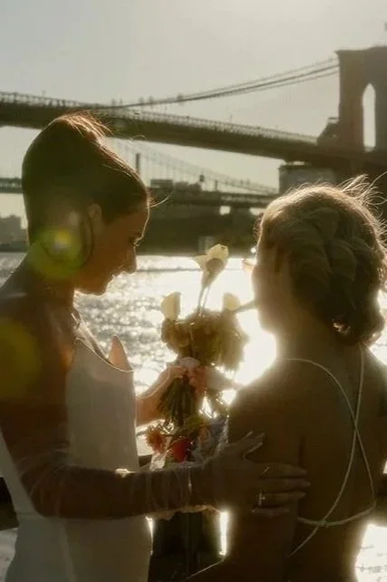 Australian couple on the waterfront after their wedding ceremony in NYC with Cakewalk.