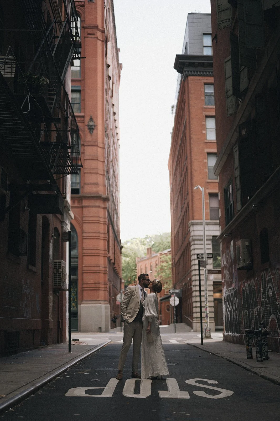 nyc-elopement-kissing-bride-groom-city-street-photography.jpg