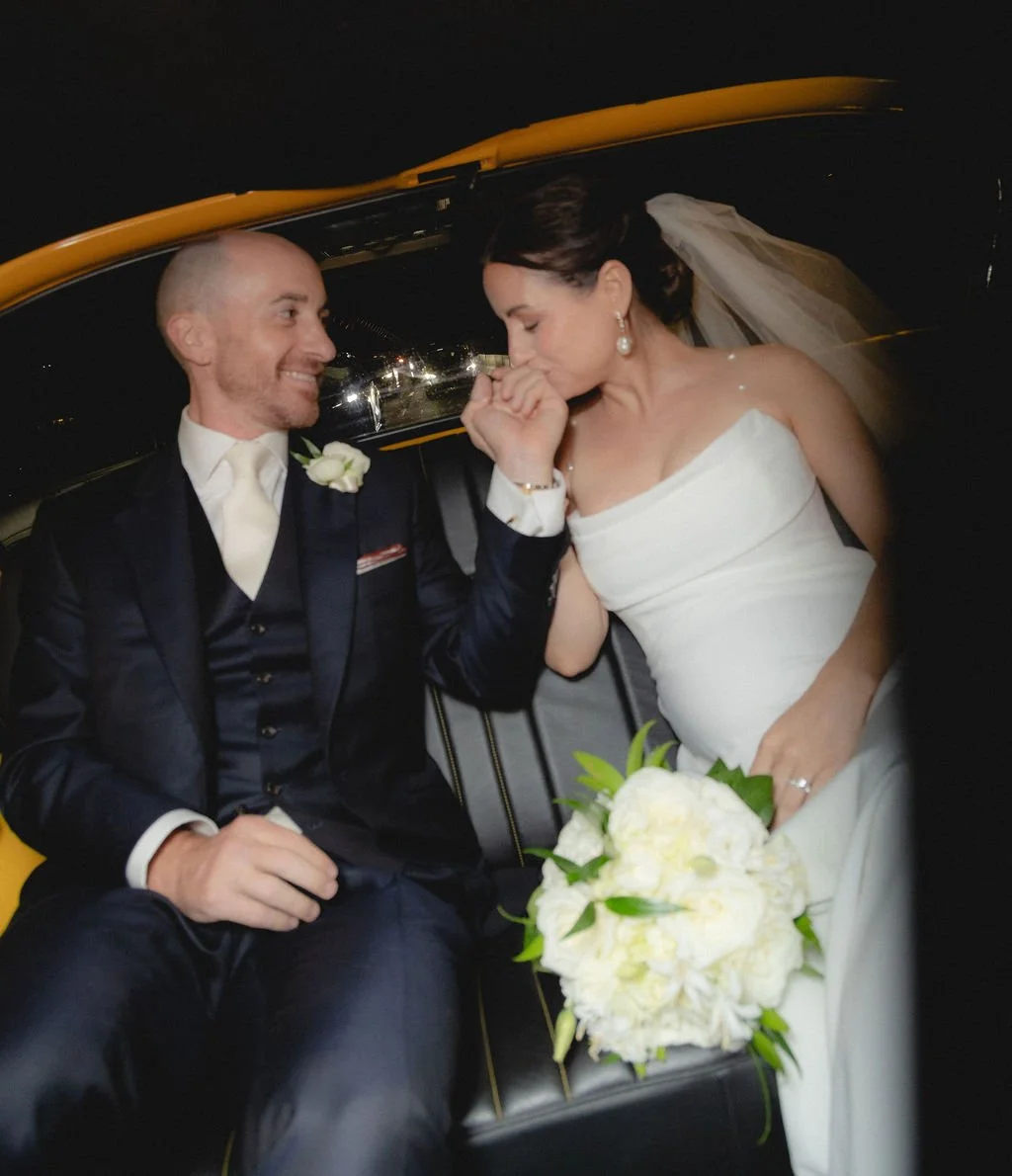 nyc-taxi-wedding-bride-kissing-groom-photography.jpg