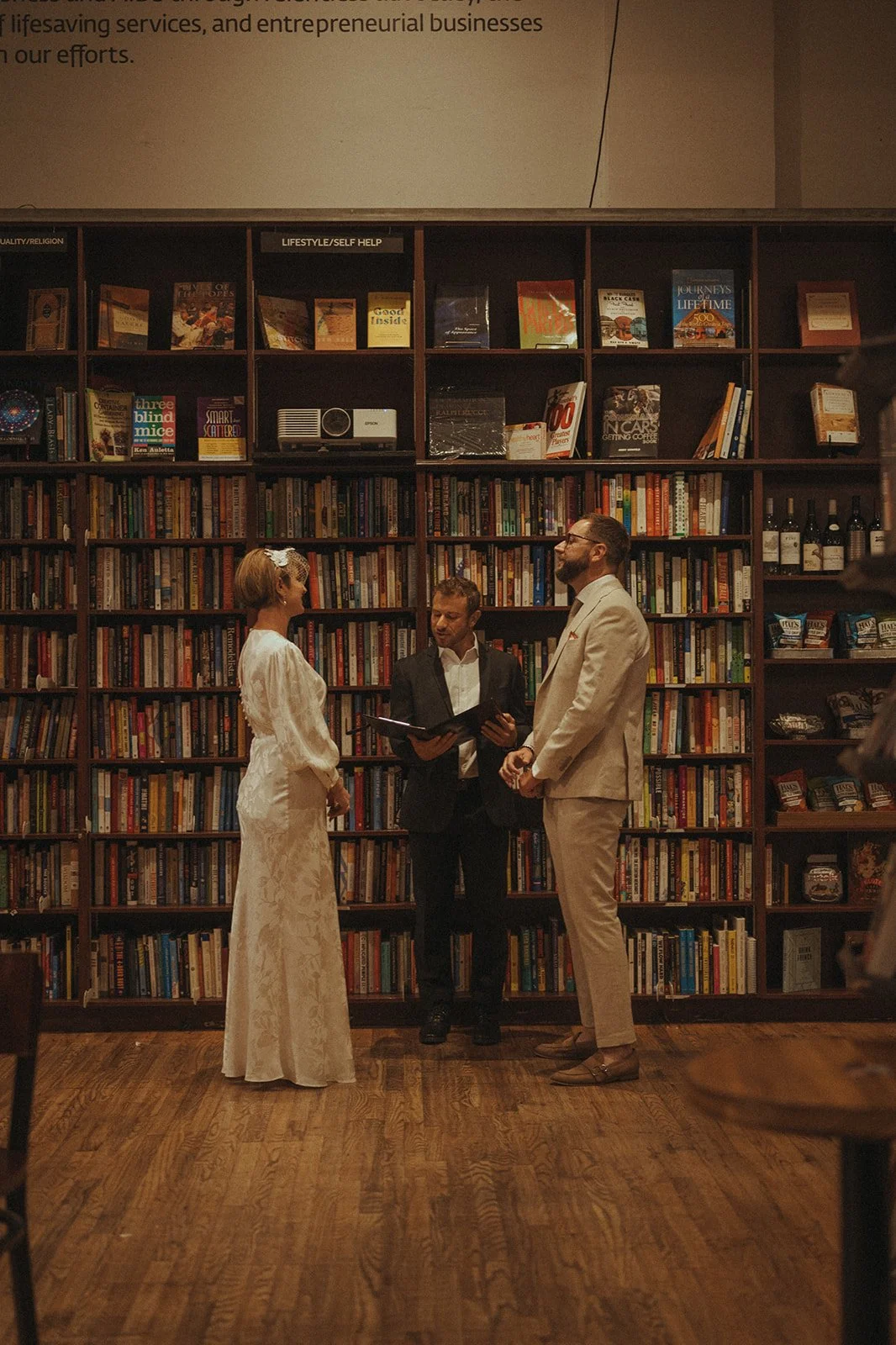 Couple exchanging vows officiated by Cakewalk at Housing Works 