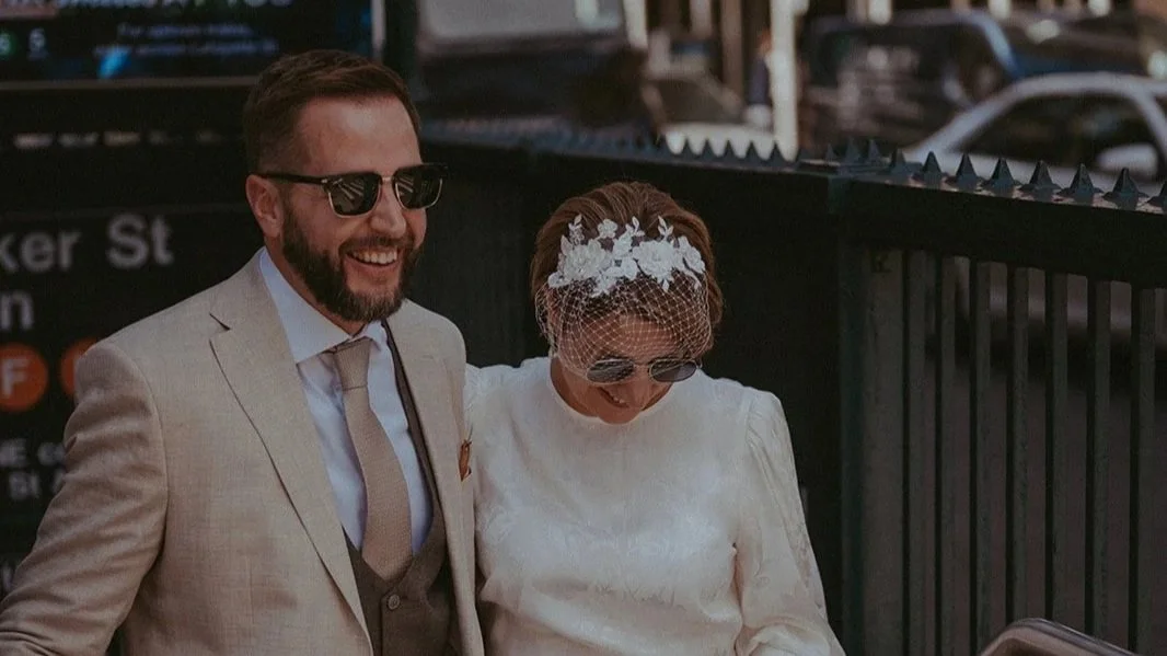Documentary style photography of couple after they just got eloped with Cakewalk on the subway in New York City.