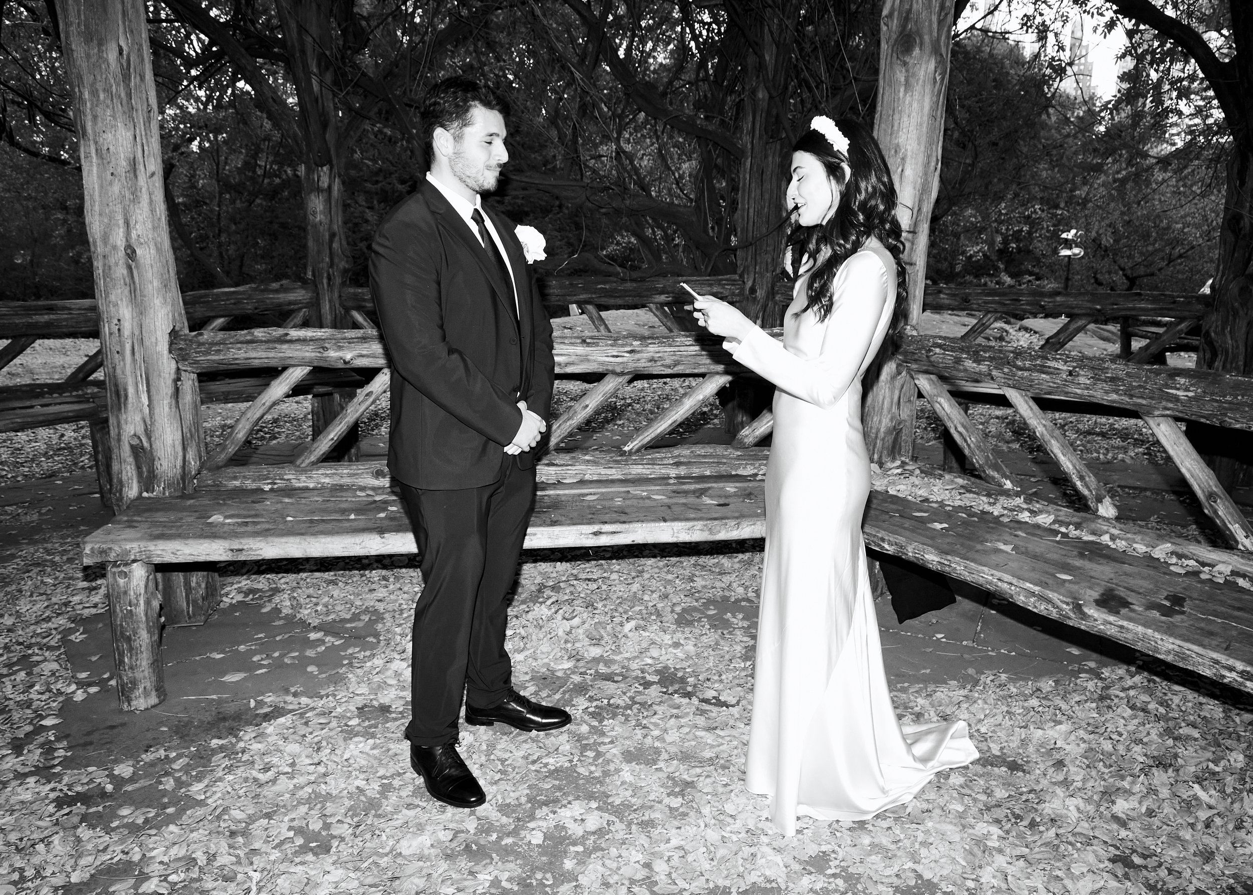 Couple exchanging vows during a Cop Cot elopement ceremony in Central Park, New York City
