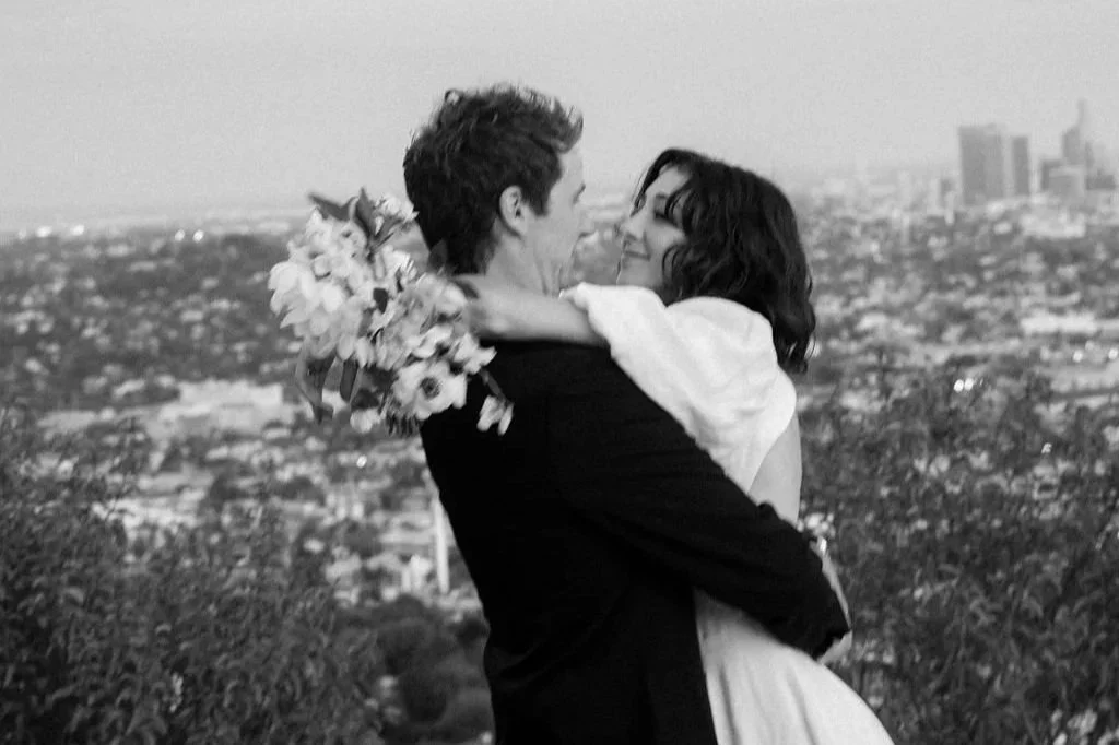 Couple walking a Los Angeles waterfront at sunset