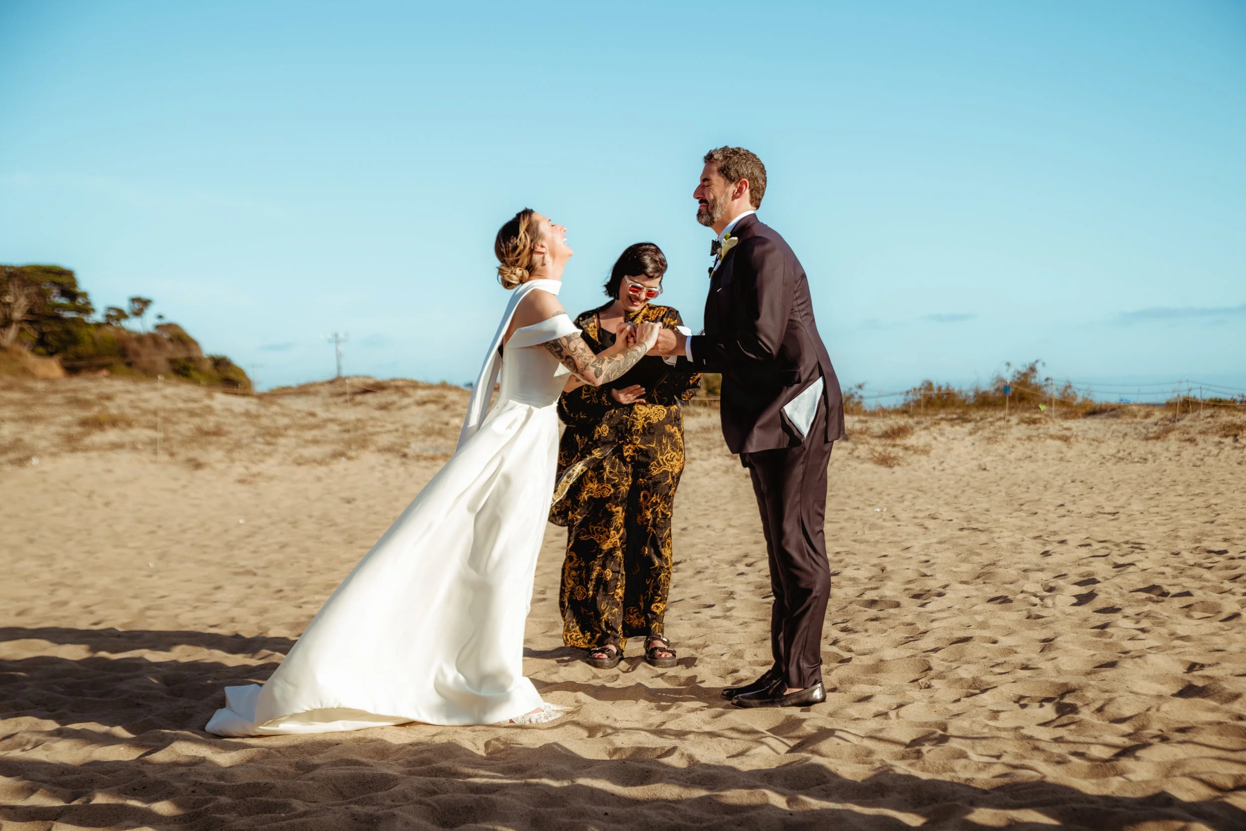 Couple getting married by Cakewalk officiant on Zuma Beach in Los Angeles California elopement.